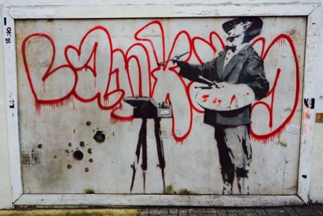 street art in london banksy graffiti painter portobello